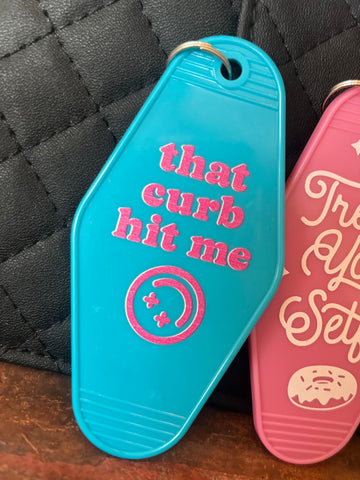 That Curb Hit Me Motel Keychain: Turquoise