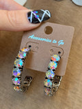 Front view of Accessories to Go silver tone hoop earrings with iridescent AB crystals