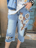 Hidden Trails Shorts by Jaded Gypsy with floral appliqués and camouflage cargo pockets