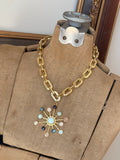 Jennifer Thames gemstone sunburst pendant necklace on chunky gold-tone chain