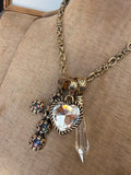 Close up of Alice Dallas gold tone convertible crystal charm necklace