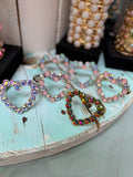 Stretch bracelets with crystal outlined hearts in silver and gold tone color options