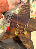 Wire-wrapped striped glass candy pendant on silver-tone chain by Art By Amy
