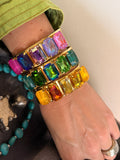 WAFA five rectangular crystal cuffs in pink purple, blue green, and golden amber