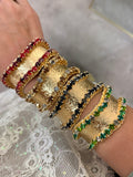 WAFA textured gold cuffs with crystal borders in clear, green, black smoke, champagne, and red