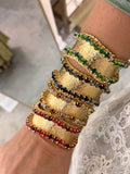 WAFA textured gold cuffs with crystal borders in clear, green, black smoke, champagne, and red